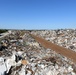 Crews Continue Work At Debris Collection Sites