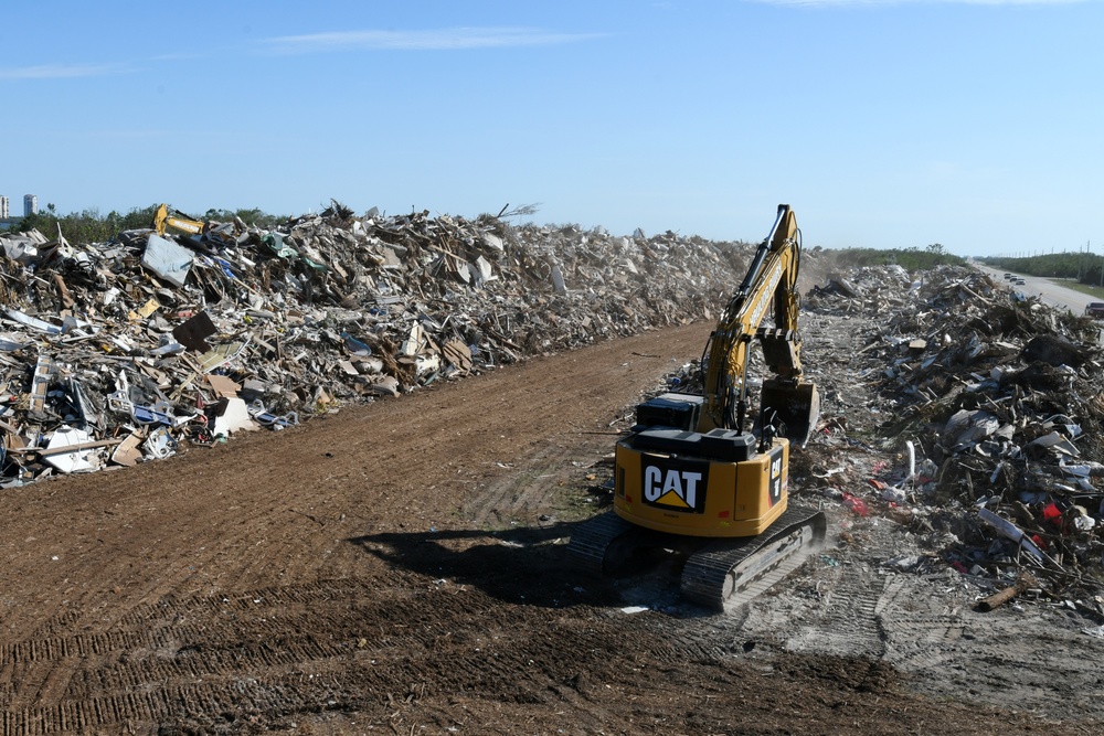 Crews Continue Work At Debris Collection Sites