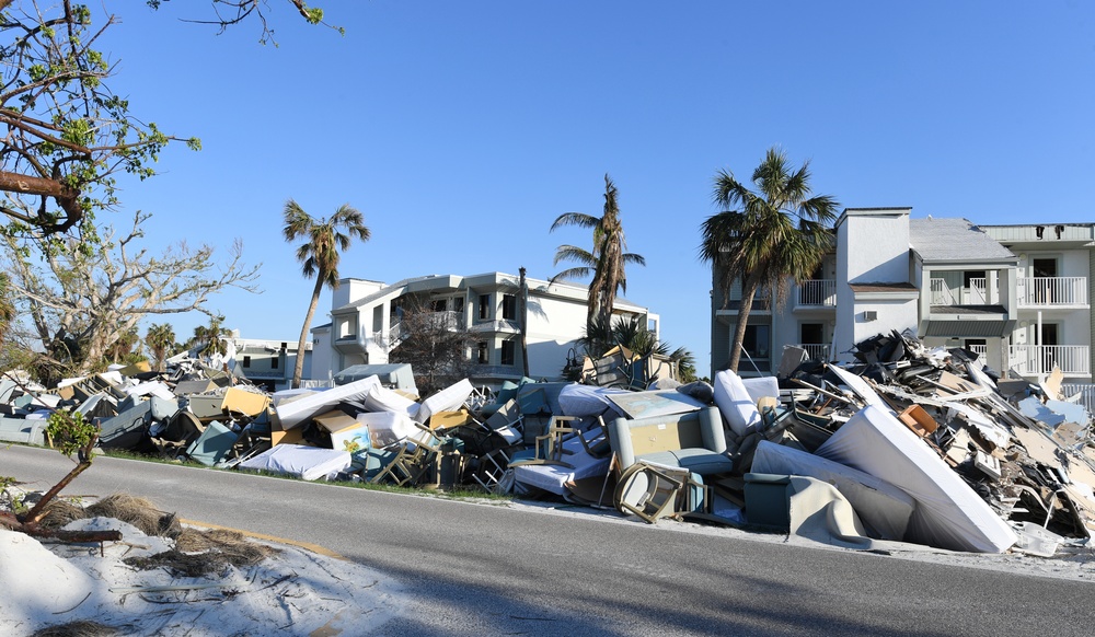 Streets Remain Stacked With Debris Following Hurricane Ian