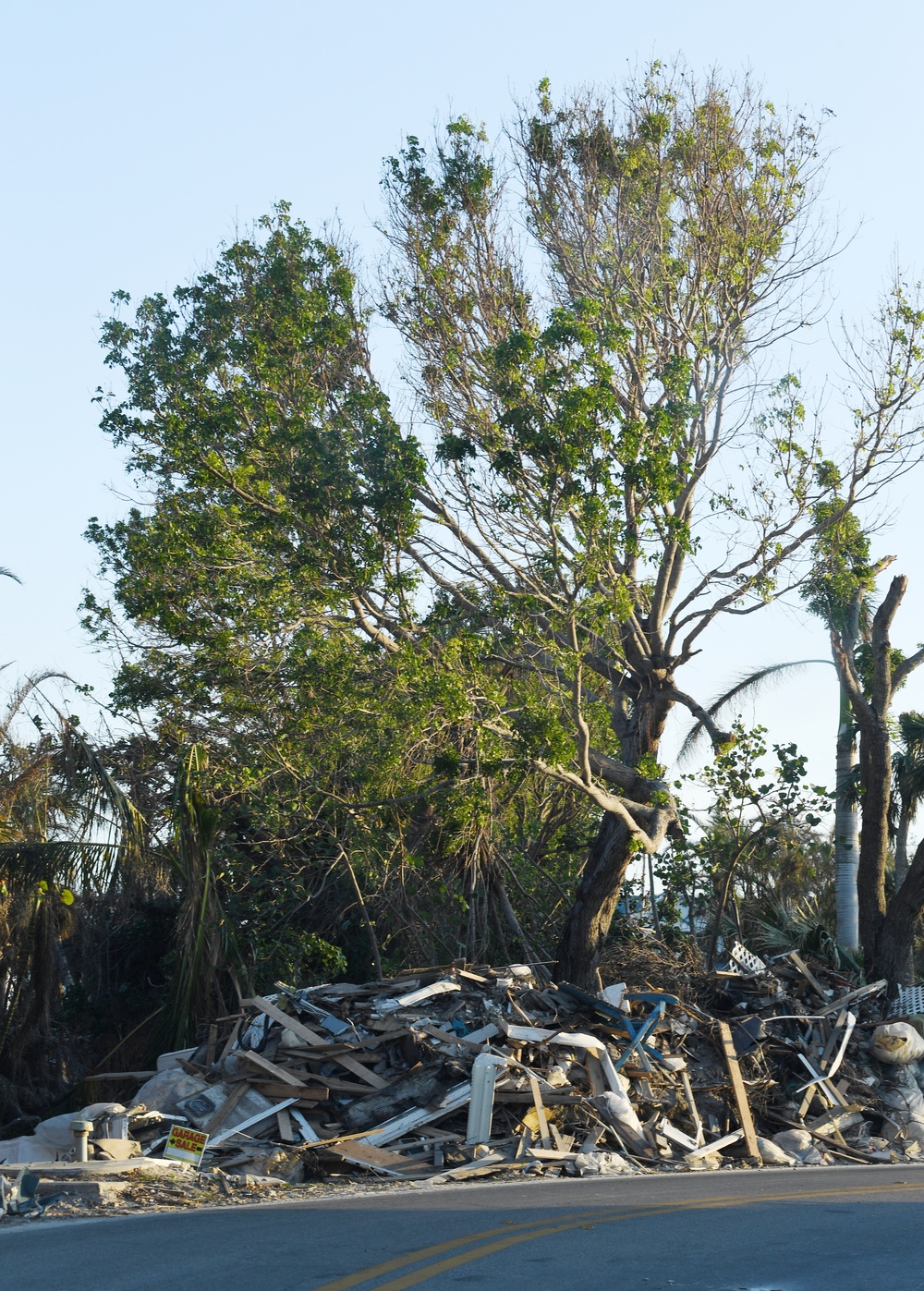 Streets Remain Stacked With Debris Following Hurricane Ian