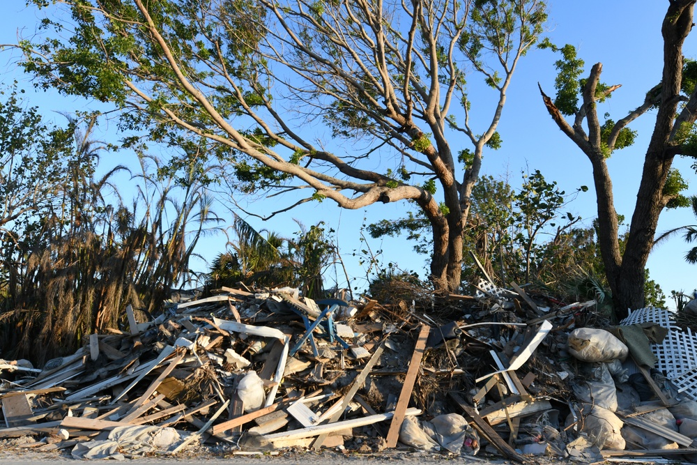 Streets Remain Stacked With Debris Following Hurricane Ian