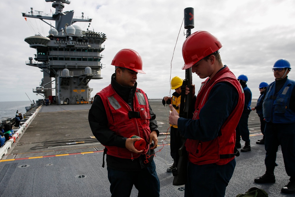 Abraham Lincoln conducts a fueling-at-sea with Henry J. Kaiser