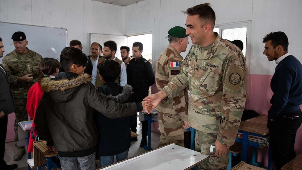 MAGN, CJTF-OIR personnel visits displaced persons to study the atmospherics of residents