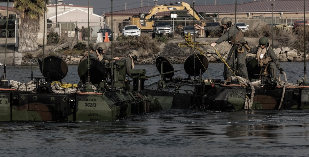 U.S. Marines execute ACV troop transfer and towing drills