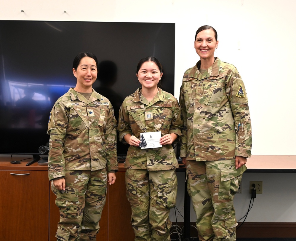 Cadet Vi-Tang poses with SBD 3 commander after receiving her USSF patch