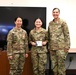 Cadet Vi-Tang poses with SBD 3 commander after receiving her USSF patch