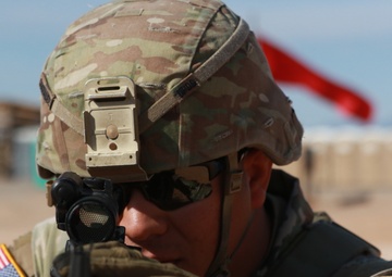 5th Armored Brigade Soldier adjusts sight on target