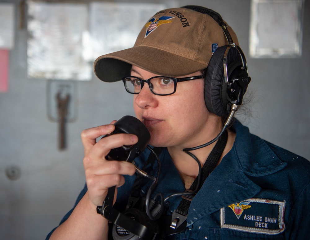 Sailor relays communications aboard USS Carl Vinson