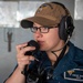 Sailor relays communications aboard USS Carl Vinson