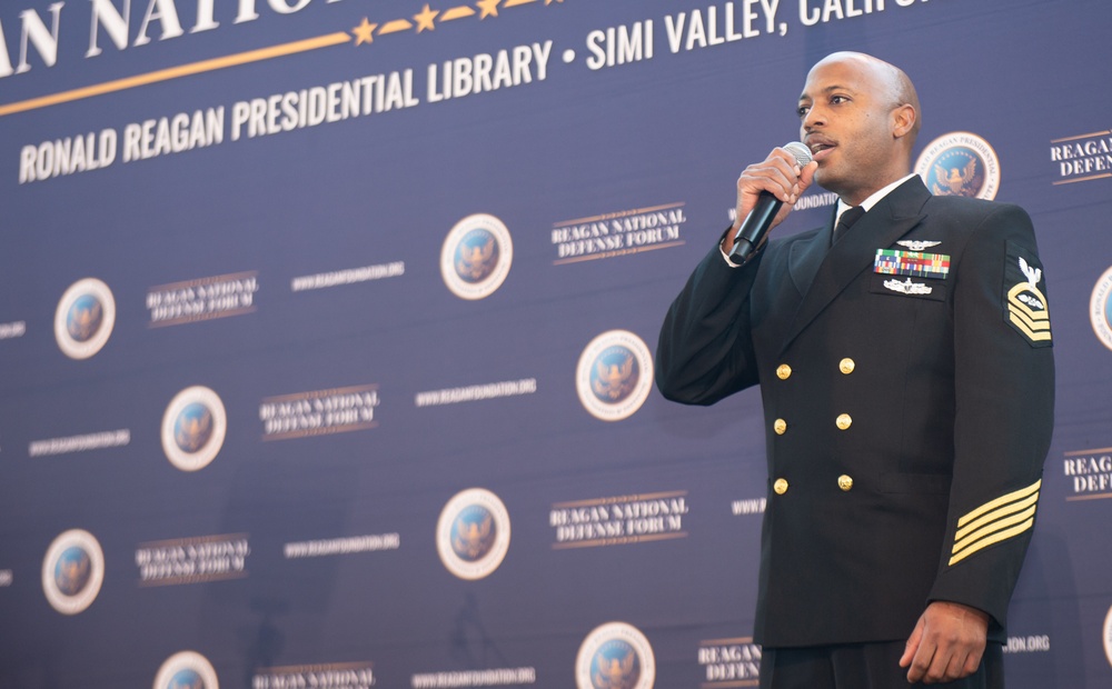 USS Ronald Reagan (CVN 76) Sailor Sings National Anthem at Reagan National Defense Forum