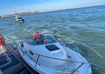 Coast Guard rescues three adults and one child from sinking vessel