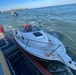Coast Guard rescues three adults and one child from sinking vessel