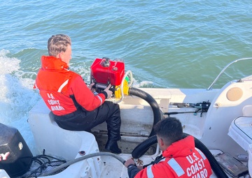 Coast Guard rescues three adults and one child from sinking vessel