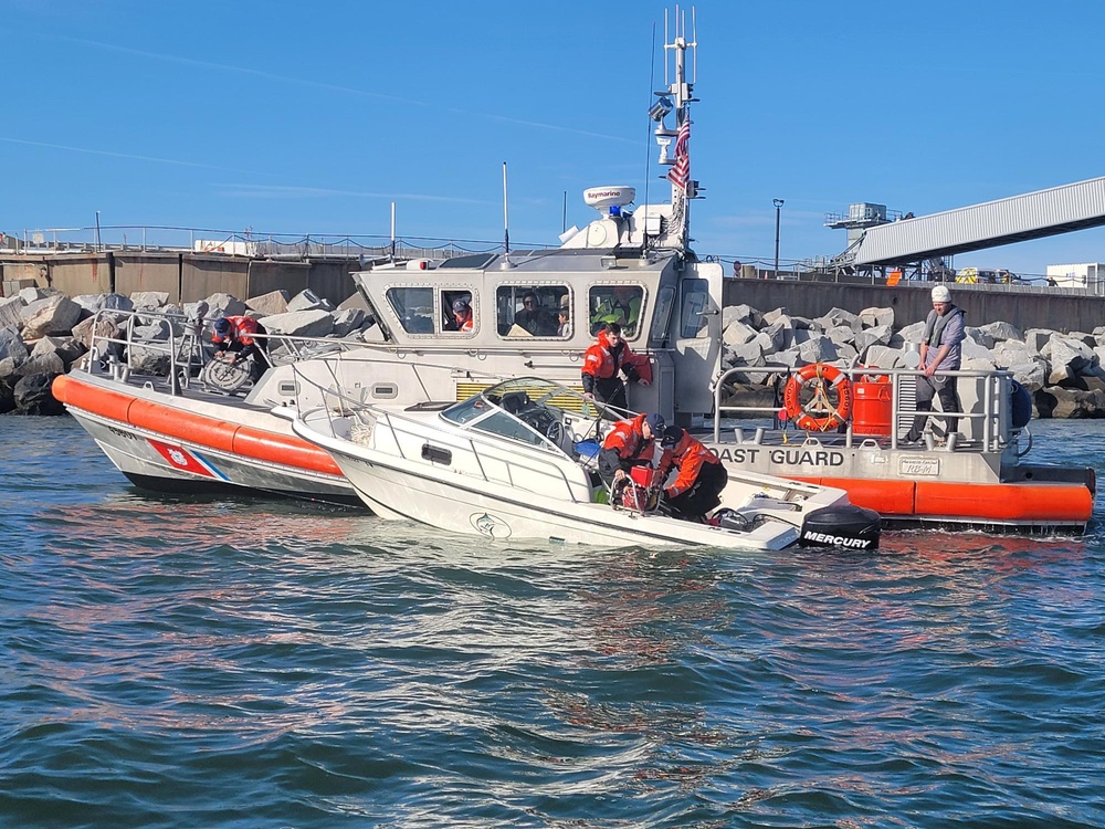 Coast Guard rescues three adults and one child