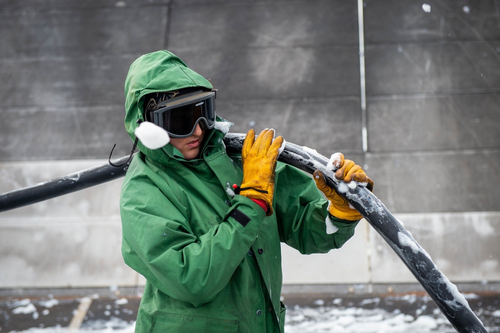 Sailor Participates in a Counter-Measure Wash-down Aboard CVN 70