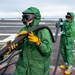 Sailor Participates in a Counter-Measure Wash-down Aboard CVN 70