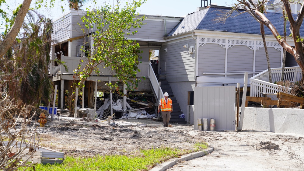 Workers Survey Damages Caused by Hurricane Ian