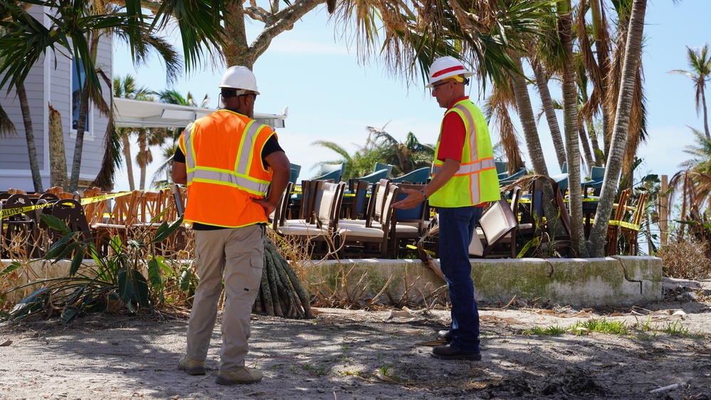 Workers Survey Damage Caused by Hurricane Ian