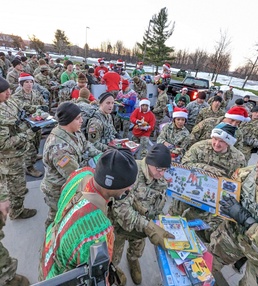Fort Drum NCOs march on a mission to deliver a “Mountain of Toys”