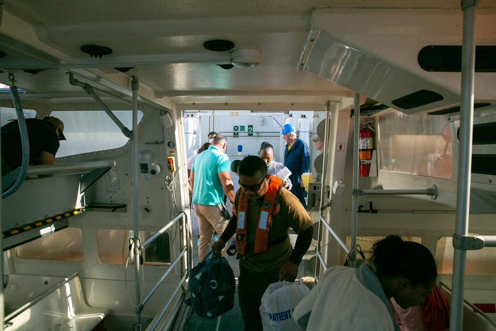 CIVILIAN MARINERS ABOARD USNS COMFORT TRANSPORT PATIENTS, DOMINICAN REPUBLIC