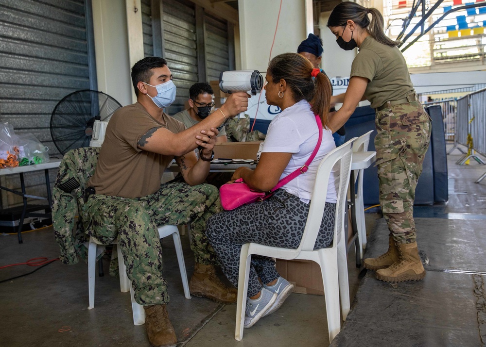 U.S. Navy Sailors assigned to the USNS Comfort perform medical and dental care at medical site in Azua, Dominican Republic during Continuing Promise 2022