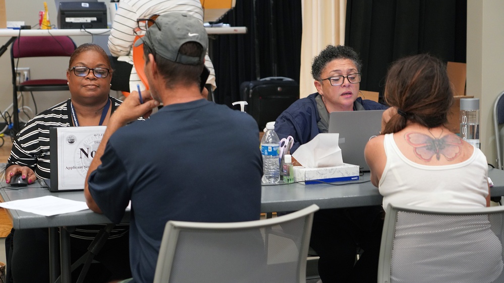 FEMA Employees Register Survivors for Assistance at a Local Disaster Recovery Center