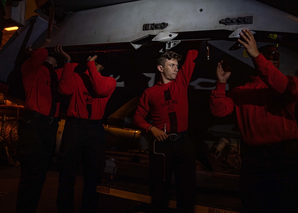 Sailors Perform Maintenance On A Super Hornet