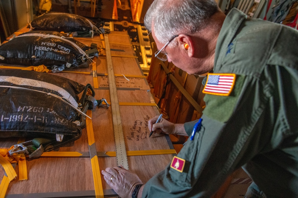 5th Air Force, United States Forces Japan, Alaskan Air Force and 11th Air Force command team drop bundles during Operation Christmas Drop 2022