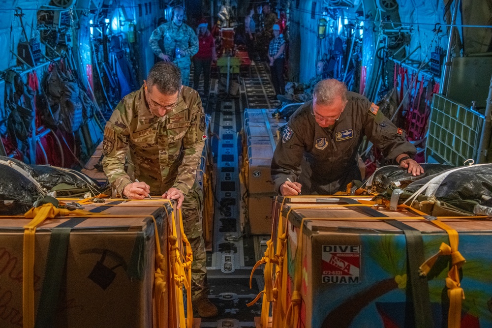 5th Air Force, United States Forces Japan, Alaskan Air Force and 11th Air Force command team drop bundles during Operation Christmas Drop 2022