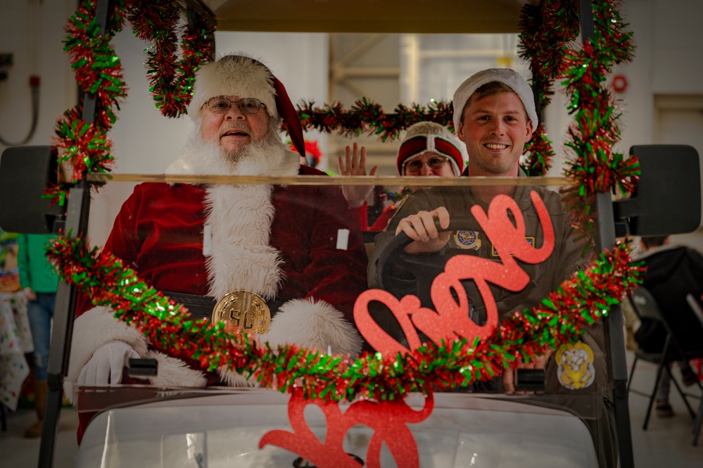 317th AW hosts Santa-in-a-Herk holiday event