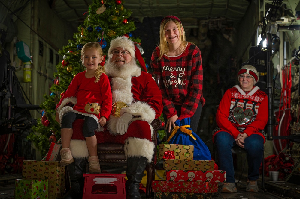 317th AW hosts Santa-in-a-Herk holiday event