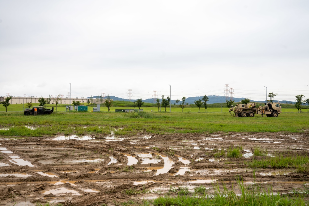 Soldiers conduct signal operations in a field environment