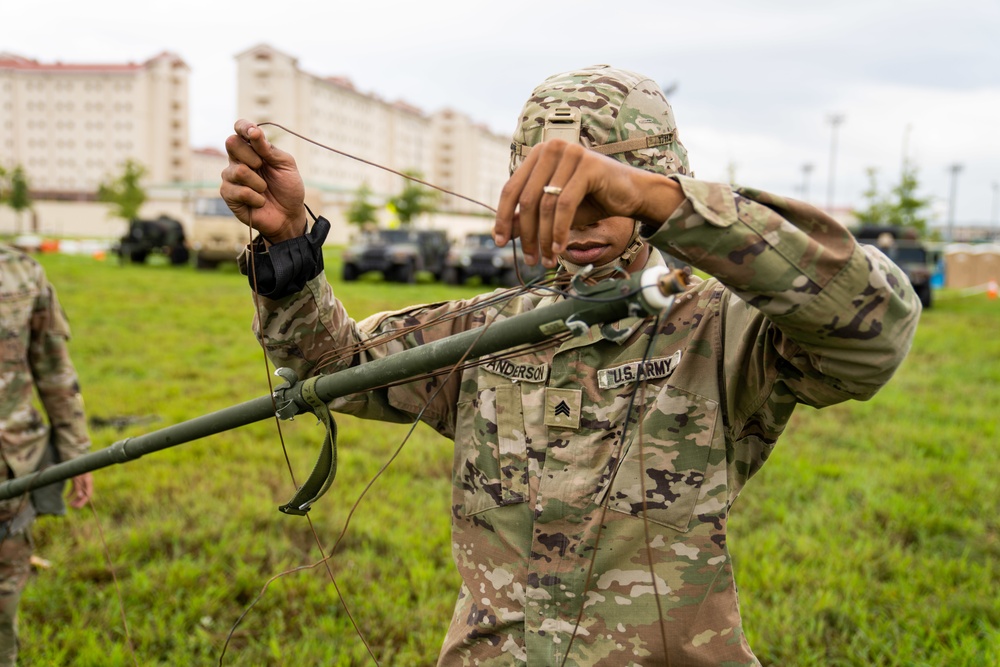 Soldiers conduct signal operations in a field environment