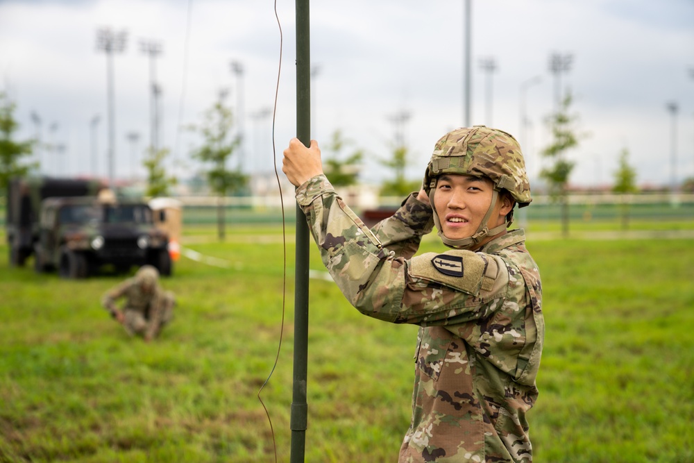 Soldiers conduct signal operations in a field environment