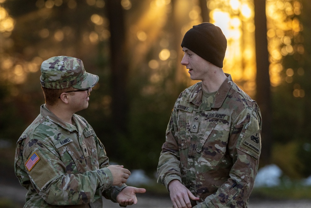 Soldiers discuss an upcoming call for fire exercise.