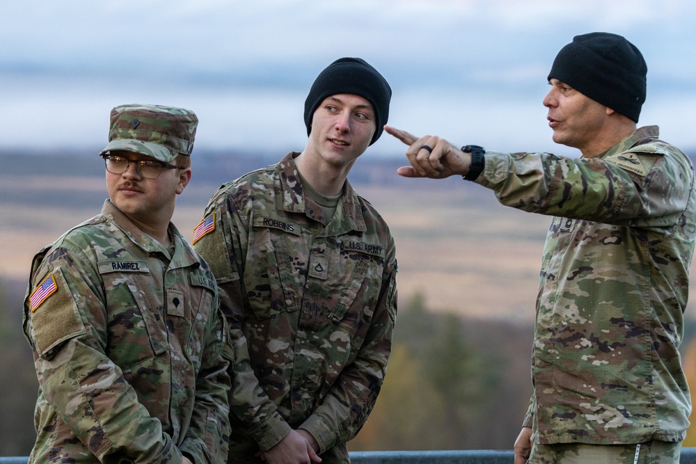 An NCO instructs his soldiers on procedures for an upcoming call for fire mission
