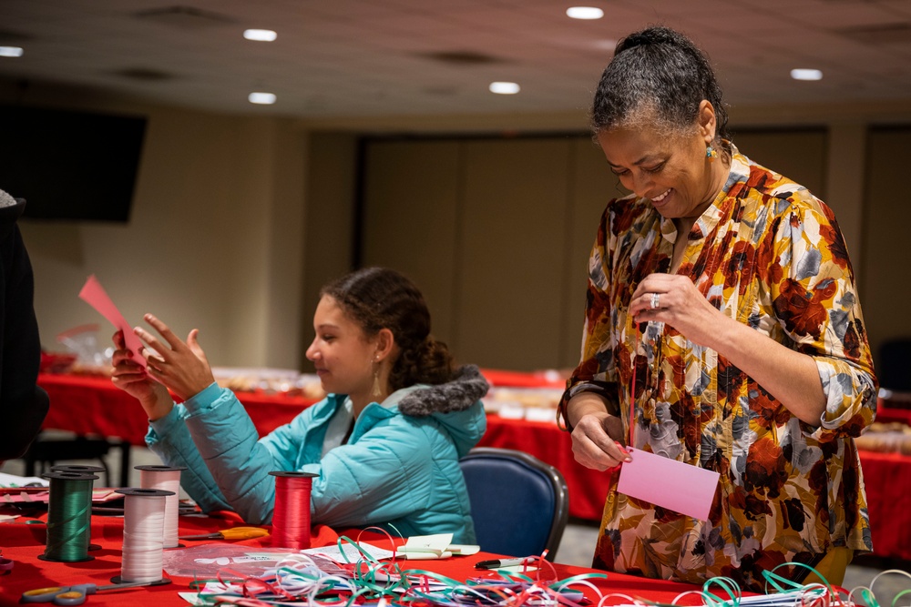 Team Seymour Spouses Club donates cookies to dorm Airmen