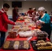Team Seymour Spouses Club donates cookies to dorm Airmen