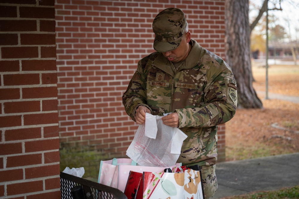 Team Seymour Spouses Club donates cookies to dorm Airmen