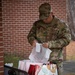 Team Seymour Spouses Club donates cookies to dorm Airmen
