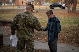Team Seymour Spouses Club donates cookies to dorm Airmen