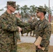 An Explosive Ordnance Disposal Marine receives a Certificate of Excellent Personal Action