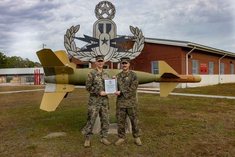 An Explosive Ordnance Disposal Marine receives a Certificate of Excellent Personal Action