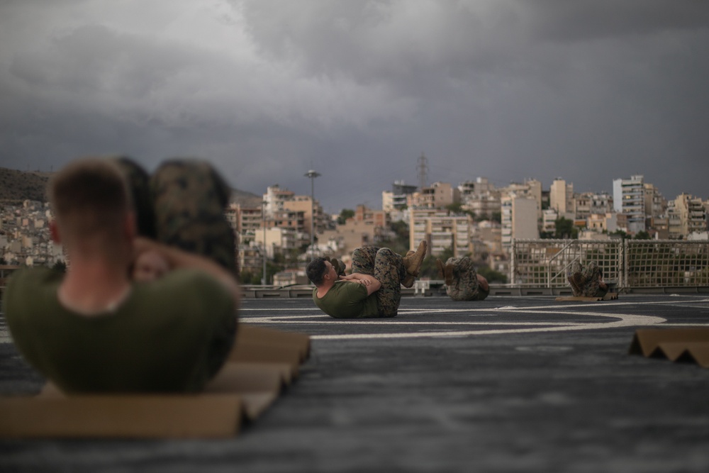 U.S. Marines with II MEF conduct Physical Training aboard USNS Trenton