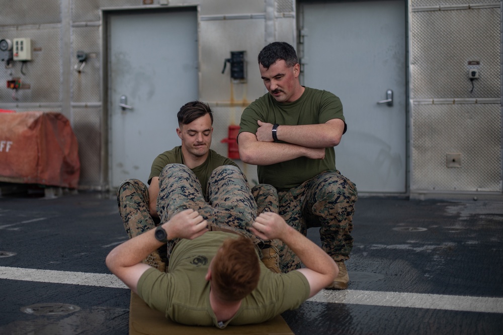 U.S. Marines with II MEF conduct Physical Training aboard USNS Trenton