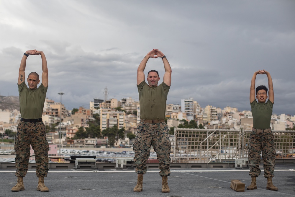 U.S. Marines with II MEF conduct Physical Training aboard USNS Trenton