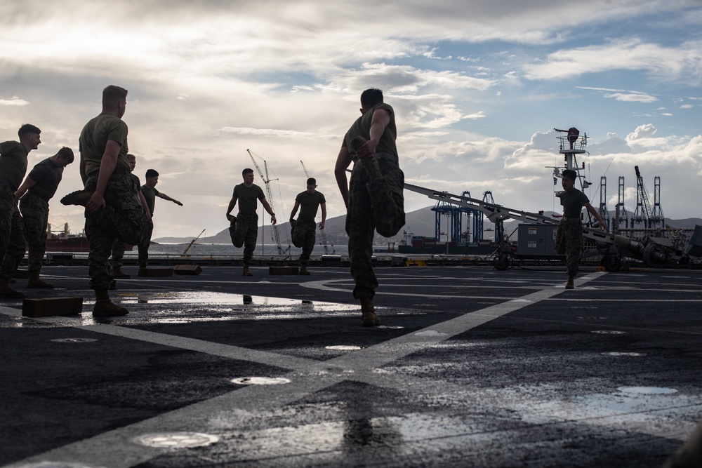 U.S. Marines with II MEF conduct Physical Training aboard USNS Trenton