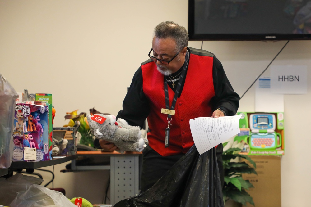 Soldiers from the 3rd Infantry Division help with the Army Community Service Toy Drive