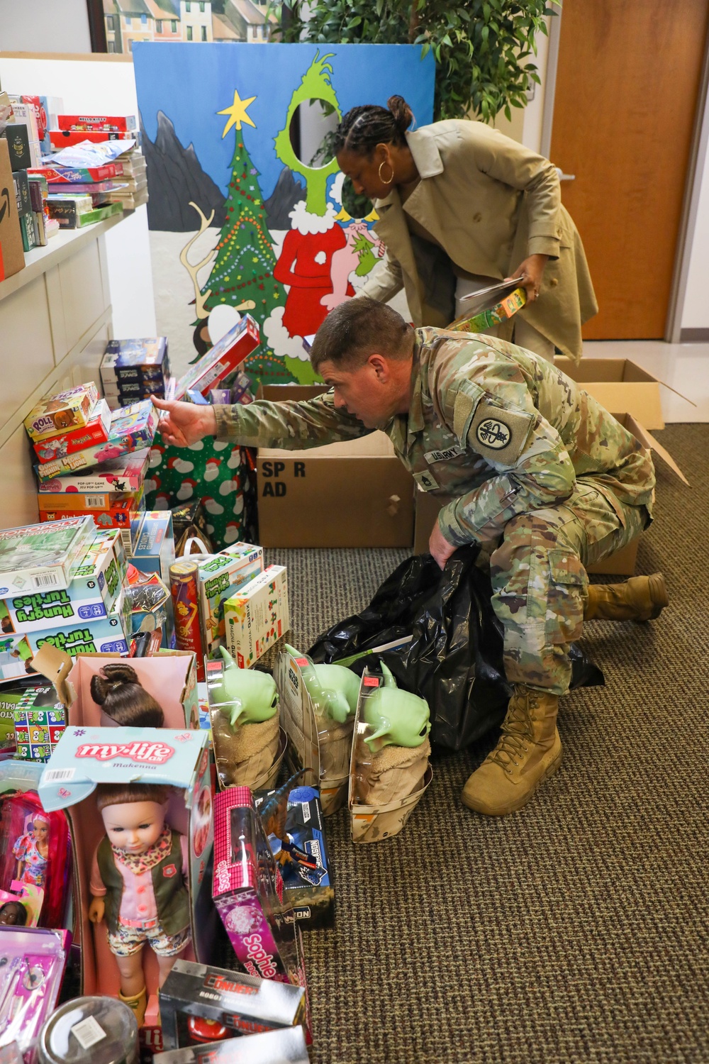 Soldiers from the 3rd Infantry Division help with the Army Community Service Toy Drive