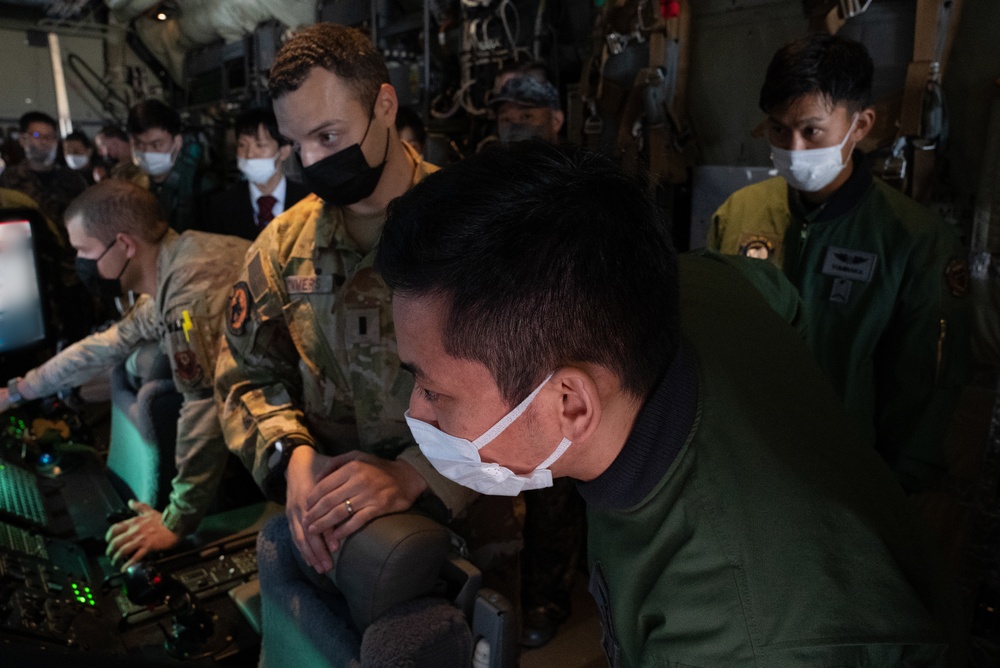 27th Special Operation Wing members receive Japanese Self-Defense Force members at Yokota Air Base, Japan